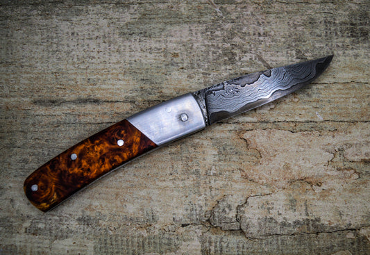Hand-forged slipjoint folding knife / Pattern-welded Go-Mai Damascus Blade / Stainless Steel Liners & Bolsters / Amboyna Burl Scales