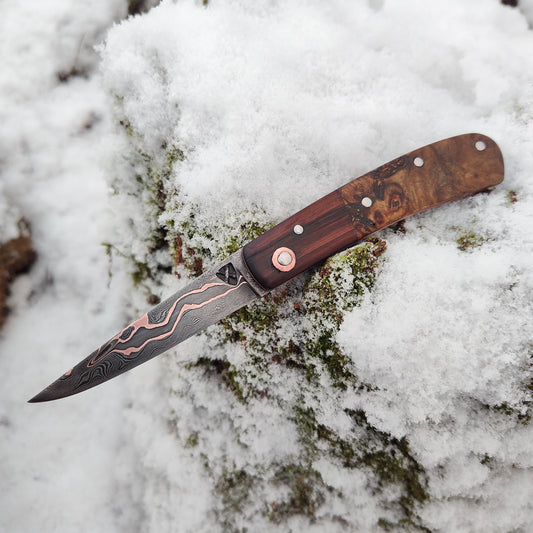 Hand-forged slipjoint folding knife / Pattern-welded Go-Mai Copper Damascus Blade / Copper Liners / Bog Yew and Ash Burl Scales