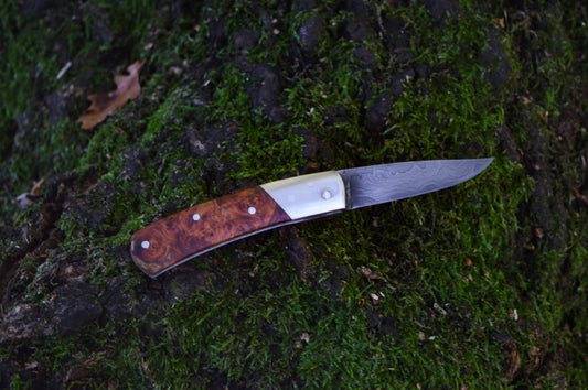Hand-forged slipjoint folding knife / Pattern-welded Go-Mai Damascus Blade / Stainless Steel Liners & Bolsters / Amboyna Burl Scales