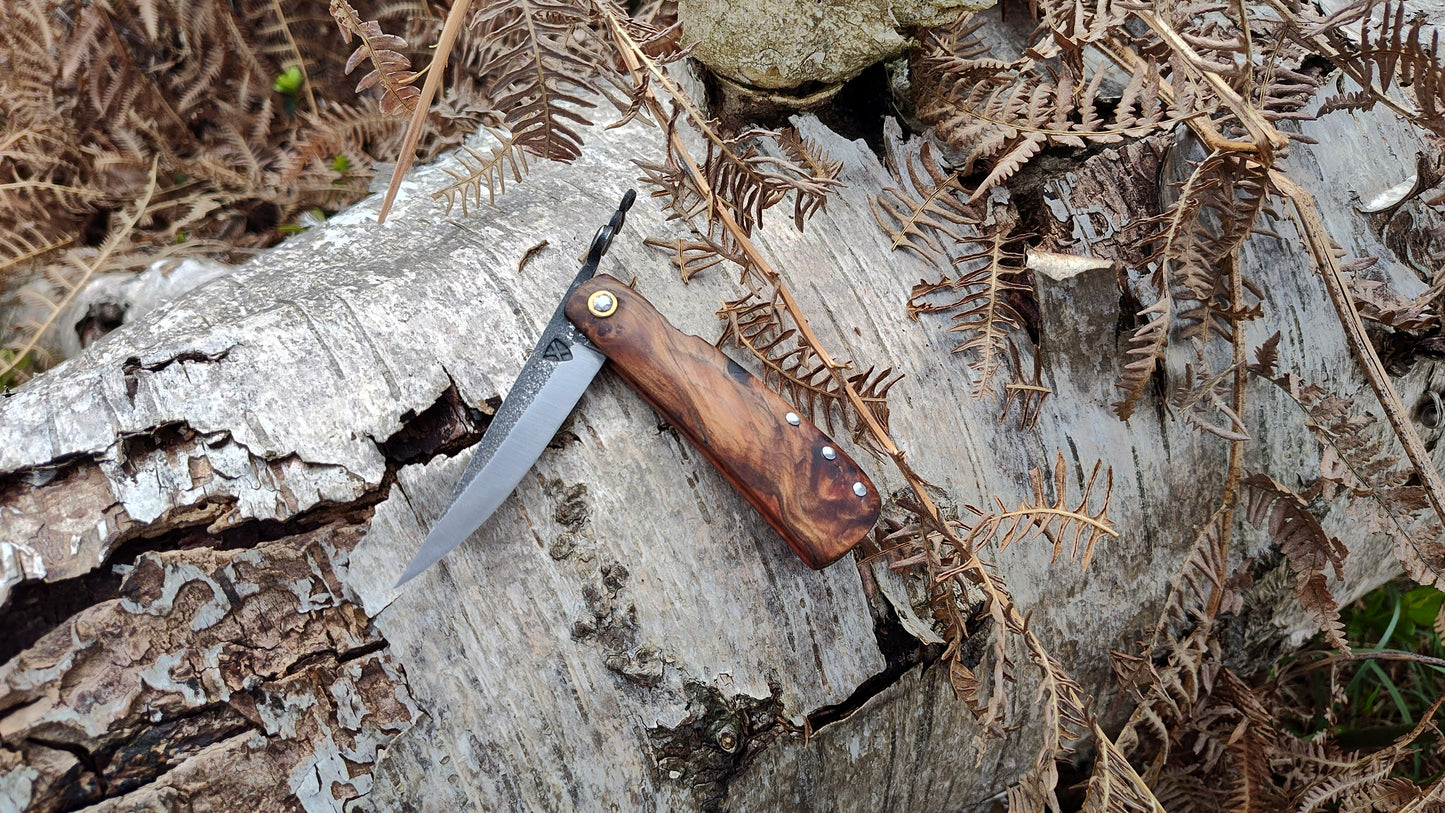 Hand-forged Friction Folder  / 52100 Carbon Steel blade / Yew Burl and mahogany scales / UK Legal Carry